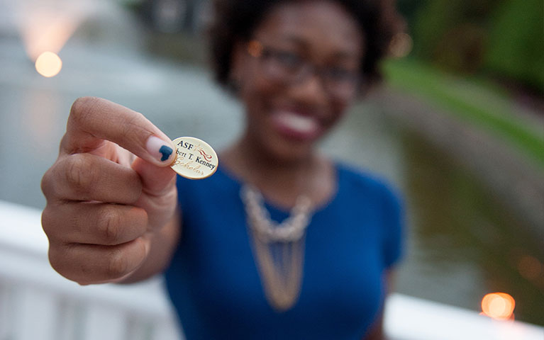 Blurred image of woman holding ASF pin